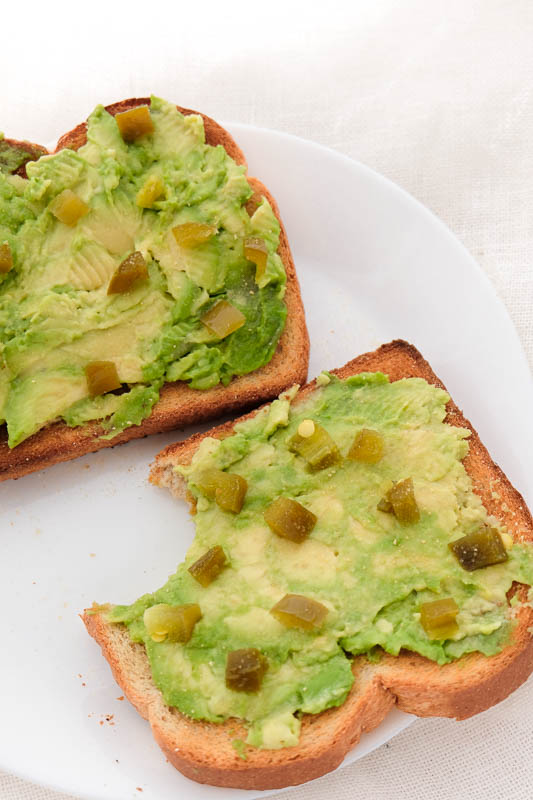 avocado toast topped with jalapeno and garlic powder.