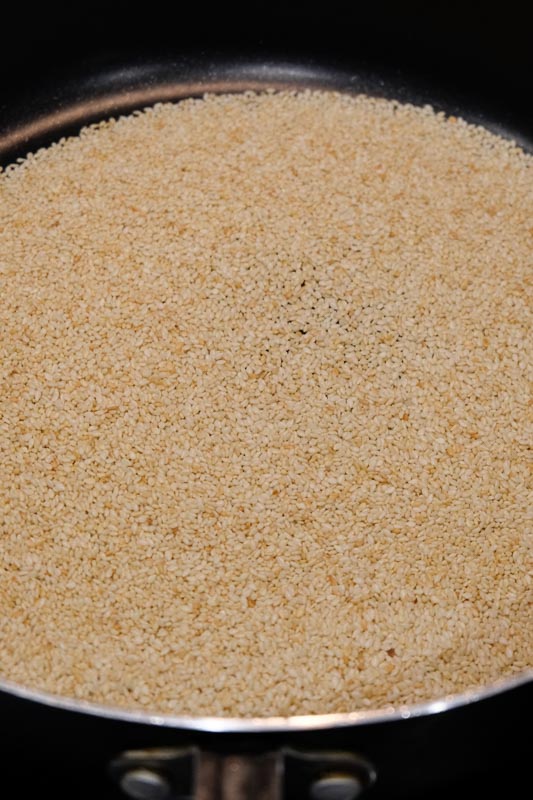 sesame seeds that have been toasted and are a deeper brown color than before.